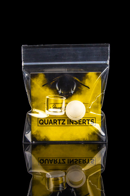 Yellow bag of “Quartz Inserts” for dabbing cannabis concentrates, displayed against a black background.