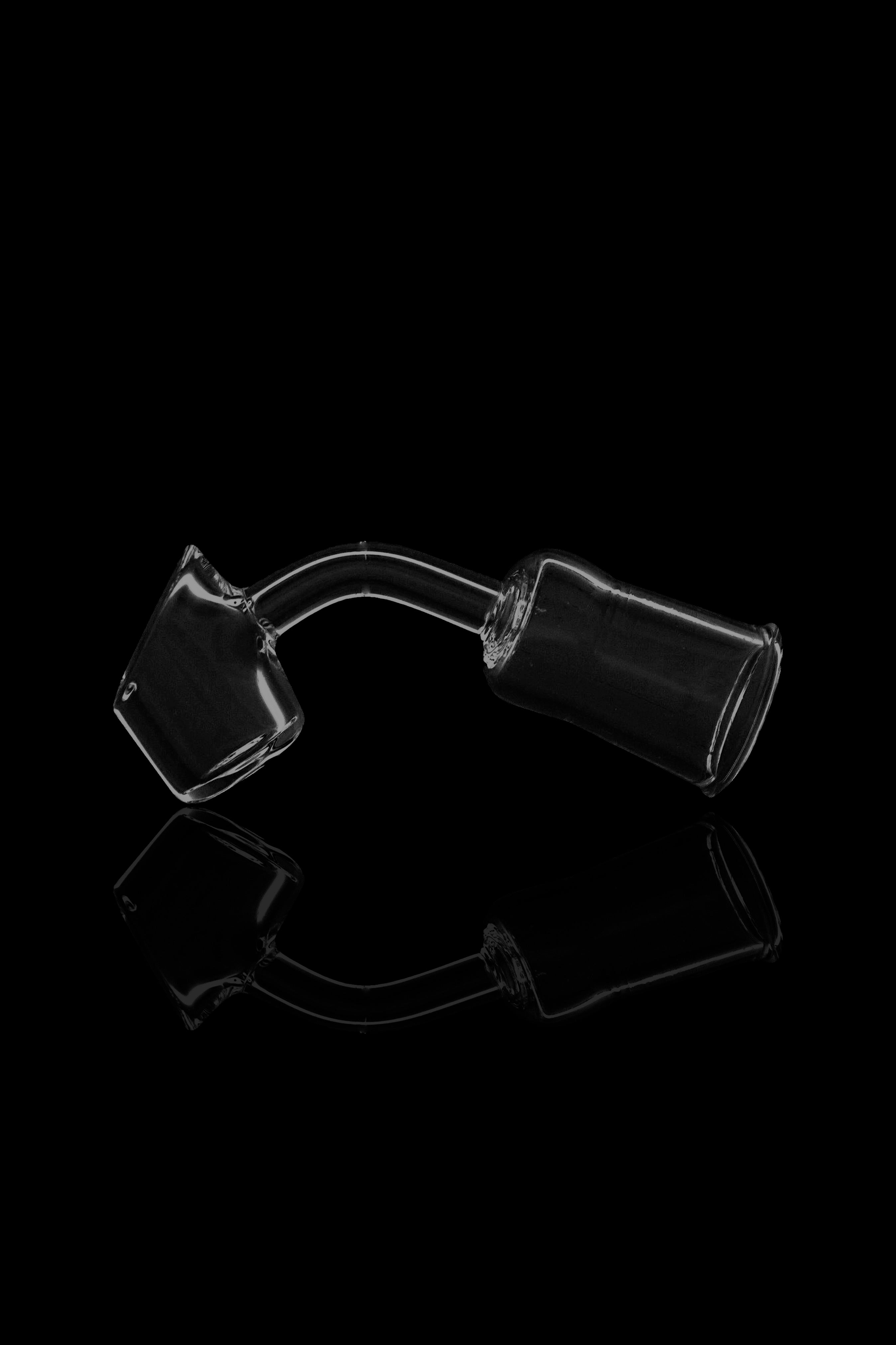 Clear glass bubbler water pipe against a black background.