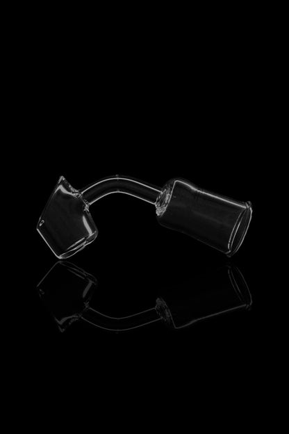 Clear glass bubbler water pipe against a black background.