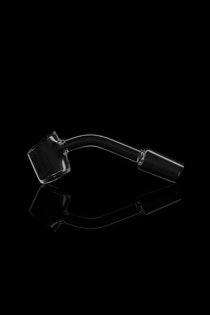 Clear glass dab rig with a bent neck and quartz insert, displayed against a black background.