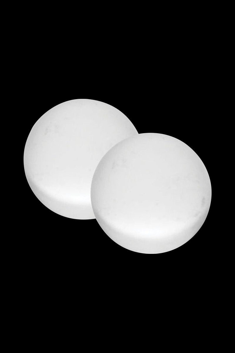 Close-up of two round white beads on a black background, showing the smooth surfaces of the Pulsar Quartz Terp Beads - 2 Piece Set 5.00% Off Auto renew