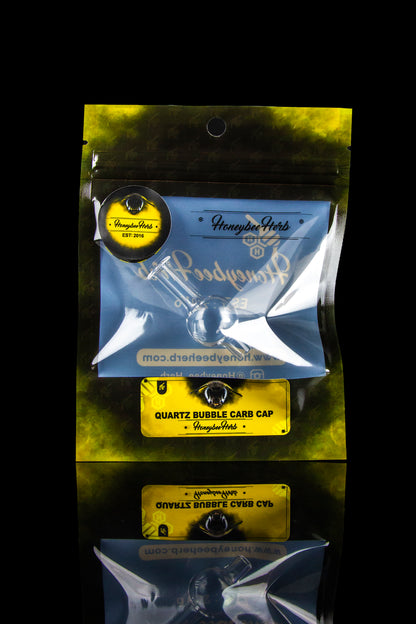 Silver mylar bag for “Quartz Bubble Cap” cannabis accessory by Honeybee Herbs.