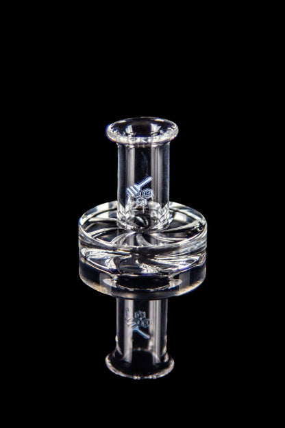 Clear glass dab rig with intricate design against a black background.