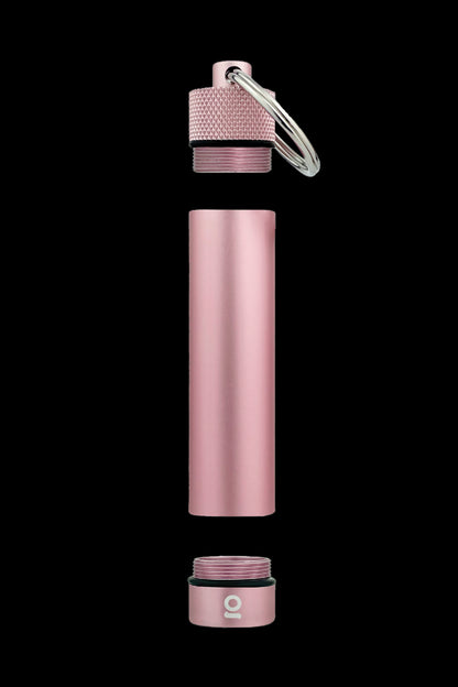Pink metallic cannabis oil vape cartridge container disassembled into three parts, with a keychain loop.
