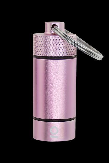 Pink metallic cannabis storage tube with a keychain loop, featuring a small logo at the base.