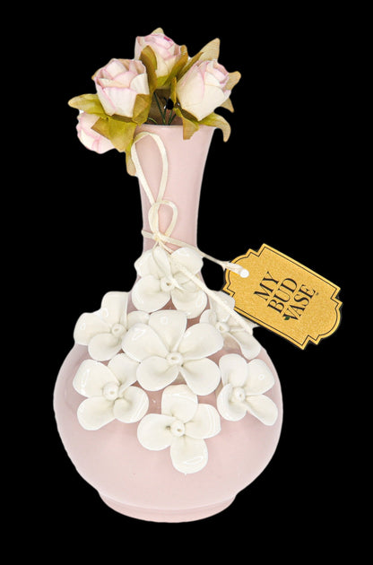 Pink glass cannabis water pipe decorated with sculpted flowers, tagged “My Bud Vase.”