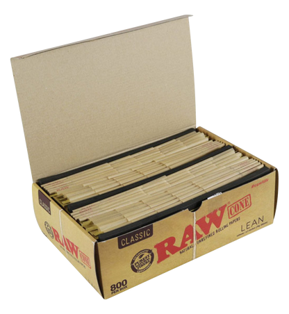 An open box of RAW Classic Bulk Lean Cones displays hundreds of pre-rolled paper cones, angled towards the viewer against a plain white background.