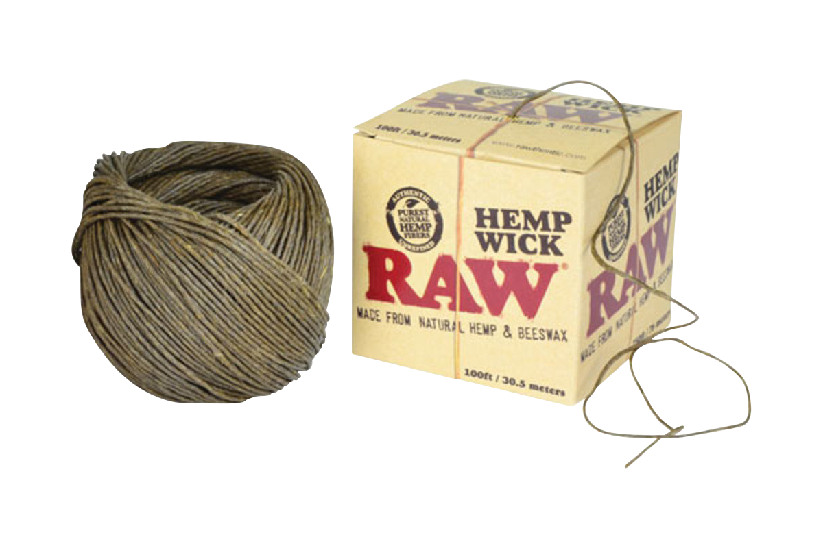 A close-up of the RAW Hemp Wick Ball, a tightly wound spool of natural fiber cord against a branded cardboard backing.