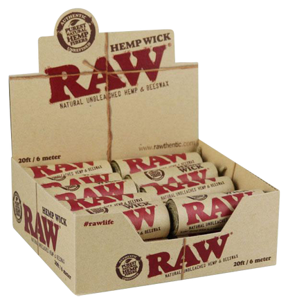 A close-up, slightly angled shot of a package of RAW Natural Hemp Wick Rolls, displaying the branded packaging and stacked rolls.