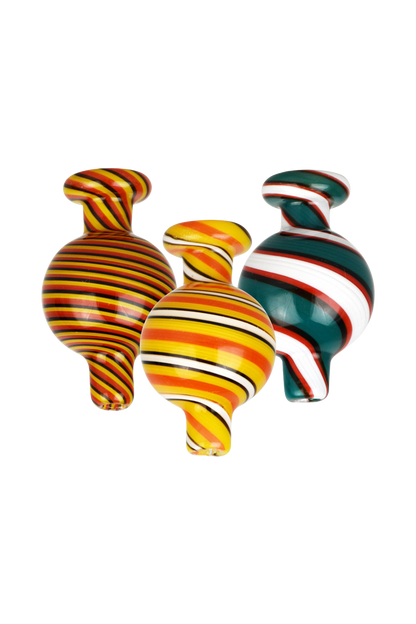 A close-up, angled view of the Reverse Color Glass Ball Carb Cap, showcasing its swirling, colorful glass design against a plain white background.