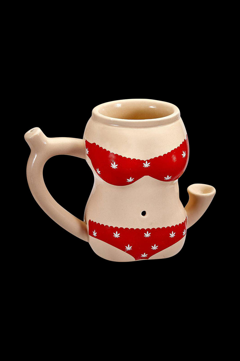 A slightly angled view of the Roast & Toast Ceramic Pipe Mug - Bikini Body, showcasing its unique ceramic design.