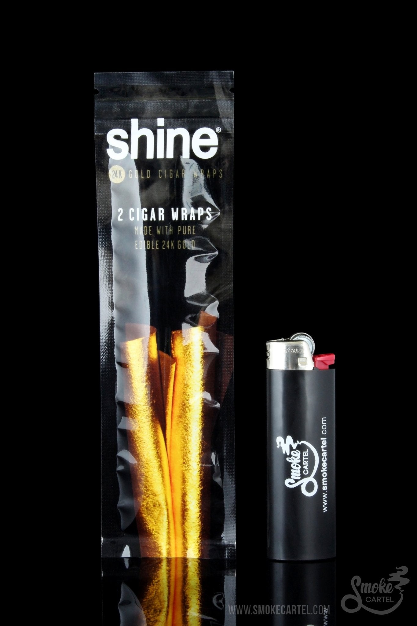 A close-up, angled shot of Shine 24k Gold Cigar Wraps packaging, with gold lettering against a dark background.