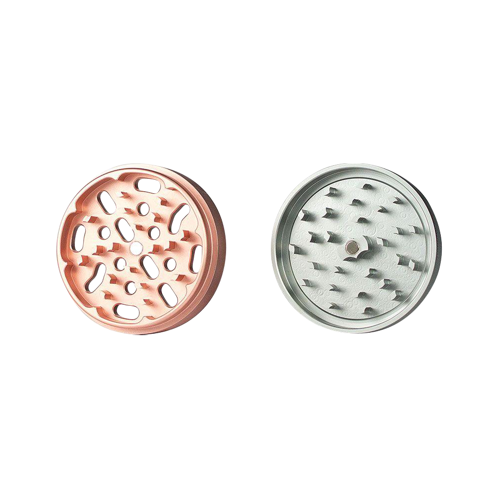 A top-down view of the Kannastor 4-Piece Solid Body Grinder, showcasing its multi-tiered, metallic finish design.