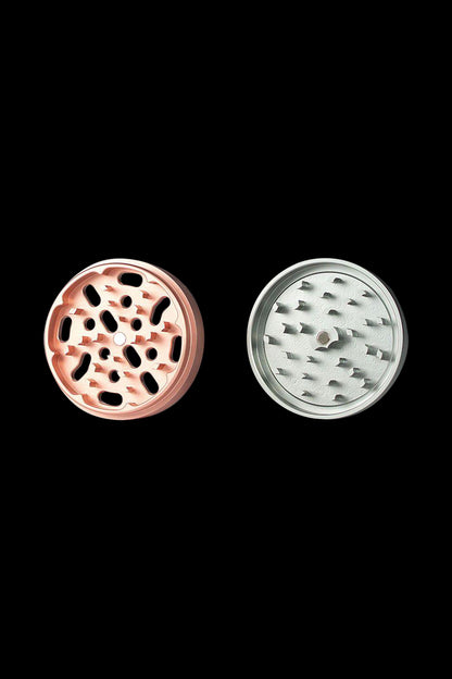 Close-up front view of the Kannastor 4-Piece Solid Body Grinder, displaying its circular metallic body with visible grinding teeth.