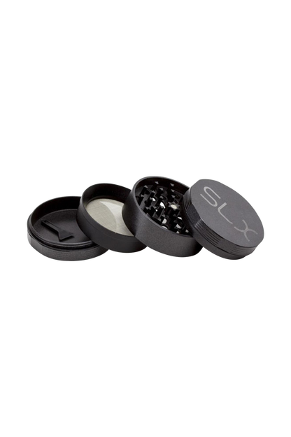 A top-down view of the disassembled SLX Ceramic Coated 2.5" Medium Grinder, showing its metallic components and interior grinding teeth.