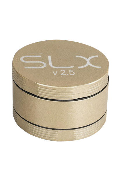 A close-up, angled view of the SLX Ceramic Coated 2.5" Medium Grinder, showcasing its metallic finish and circular design.
