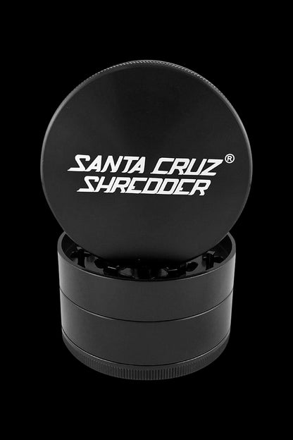 A close-up, top-down view of the Santa Cruz Shredder Grinder – Large, showing its cylindrical, multi-part metal construction.