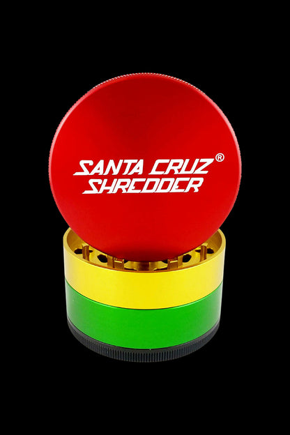 Front view of the Santa Cruz Shredder Grinder - Large, showcasing its multi-tiered, cylindrical design against a dark background.