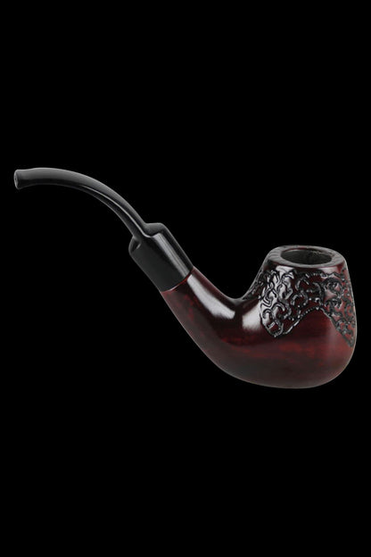 A side view of the Pulsar Engraved Bent Brandy, showcasing its curved shape and intricate detailing in a dark amber hue.
