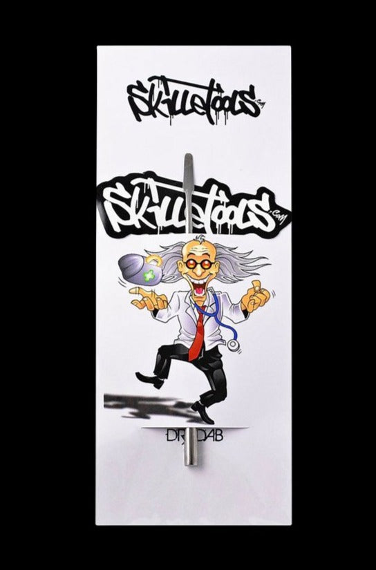 A close-up shot of the Skilletools Classic Series Metal Dab Tools, featuring a metallic tool with a detailed, sculpted design.