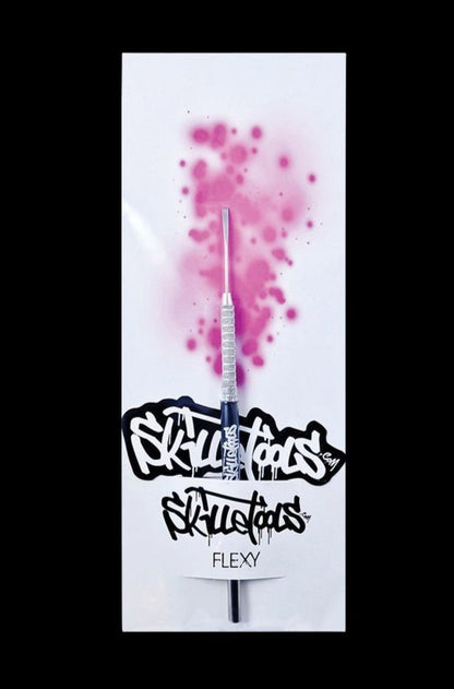 A close-up shot of the Skilletools Classic Series Metal Dab Tools with a shiny silver finish, angled against a blurred pink backdrop.