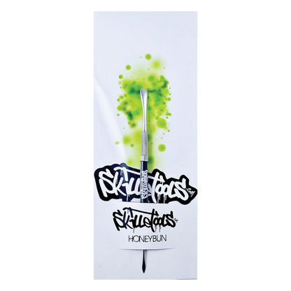 A close-up shot of the Skilletools Classic Series Metal Dab Tools with a sleek silver finish and angled tip, set against a dark backdrop.