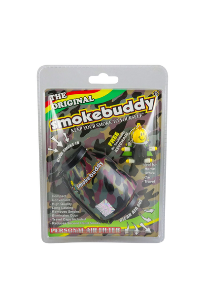 Front-on photo of the camouflage-patterned Smokebuddy Original Personal Air Filter in its plastic blister pack with colorful branding and a smiley keychain.