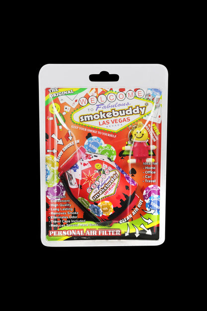 Front-facing shot of Smokebuddy Original Personal Air Filter in its colorful Las Vegas-themed blister pack against a black background.