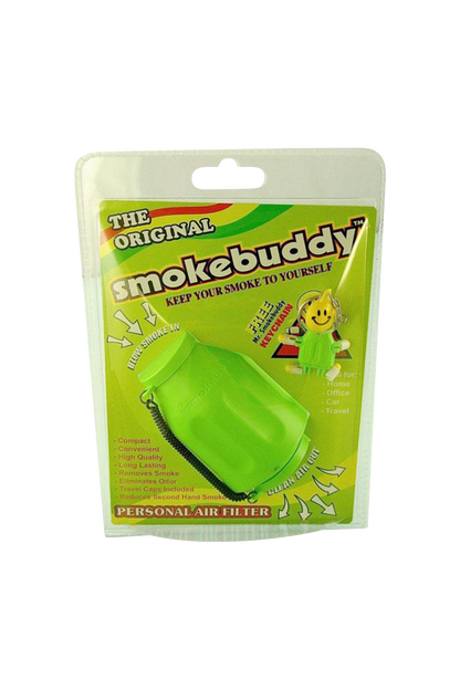 Front-facing shot of the green Smokebuddy Original Personal Air Filter in its blister pack with bold yellow-green branding and a smiley keychain.