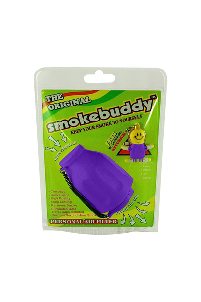 Front-facing product pack showing a purple Smokebuddy Original Personal Air Filter on bright green branded backing with a smiley keychain.