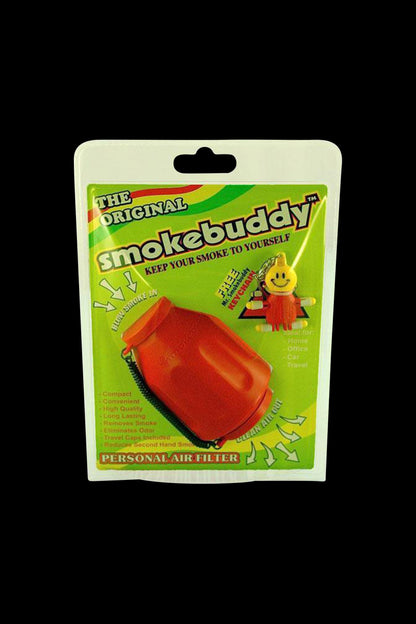 Front-facing shot of the Smokebuddy Original Personal Air Filter in red shown in its green retail blister card packaging against a black background