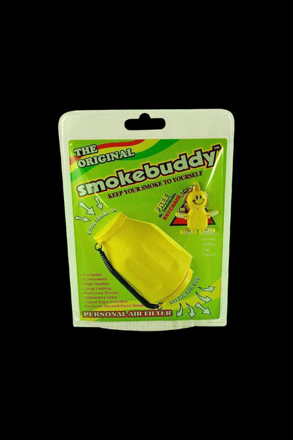 Front-facing shot of the Grenade-colored Smokebuddy Original Personal Air Filter in its green blister-packaging against a black background.