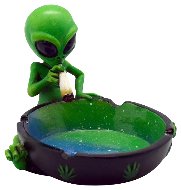 A detailed view of the Smoking Alien Ashtray, showing a green alien figurine holding a cigarette over a small, dark-colored ashtray.