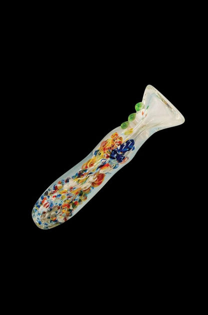 A detailed close-up of the Splatter Frit Glass Chillum Taster Pipe, showcasing its colorful frit pattern and slender design.
