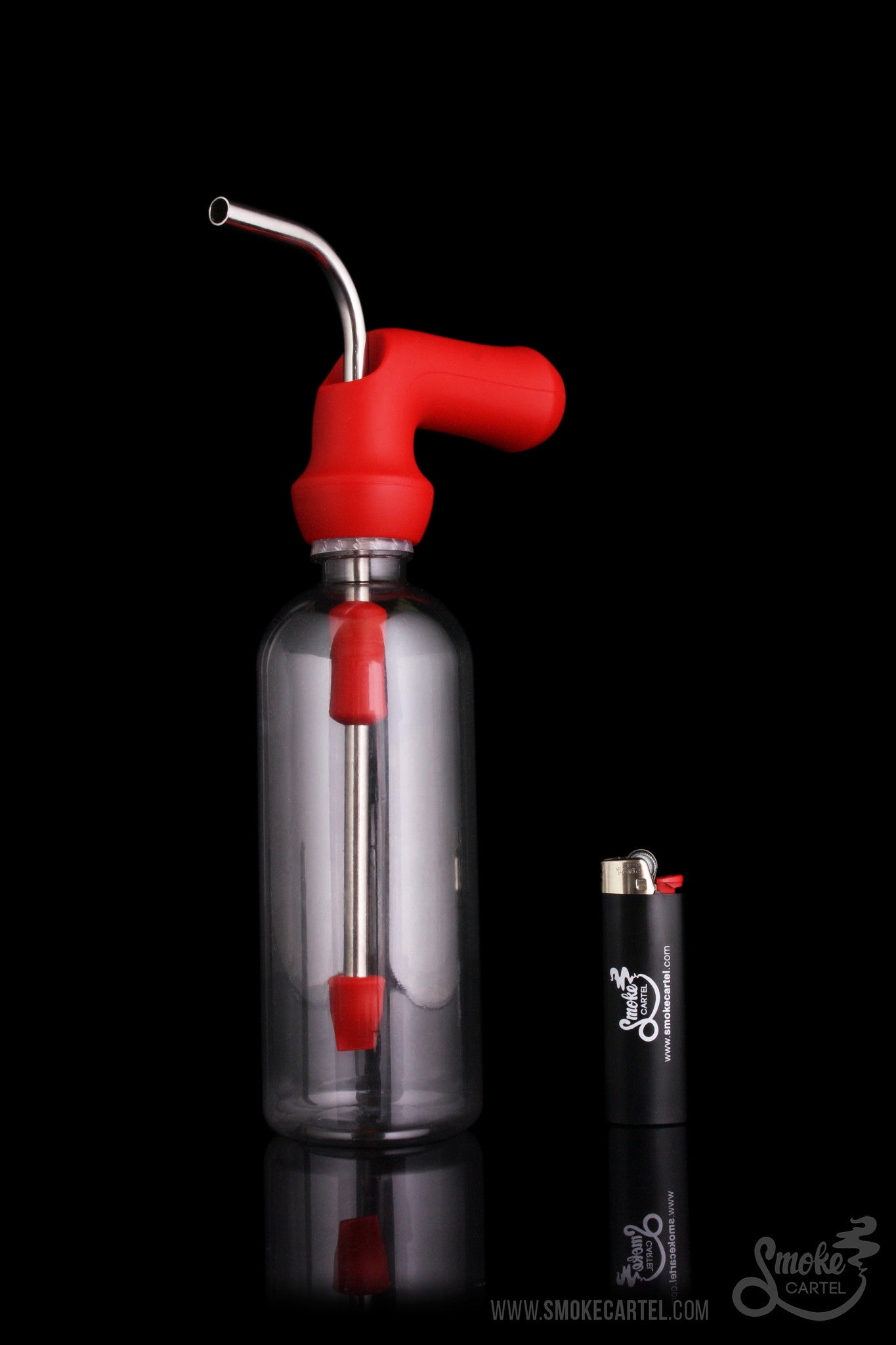 Red and clear glass oil rig with a dome and titanium tip, alongside a lighter with branding.