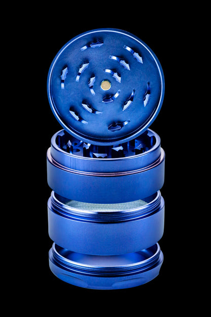 Blue four-piece metal grinder for cannabis.