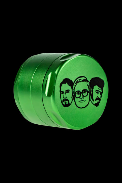 Green metal grinder with portraits of the cast from the movie "Pineapple Express" etched on the side.