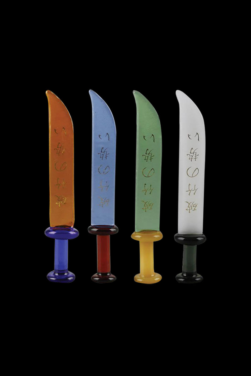 A side view of four The God of War Glass Dabber Tools in varying jewel-toned colors, arranged against a black background.