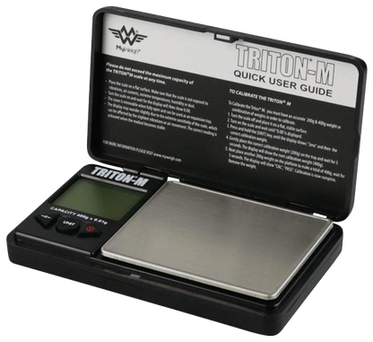 Close-up shot of the open Triton M 400g x 0.01g Scale By My Weigh, displaying instructions on its stainless steel weighing platform.