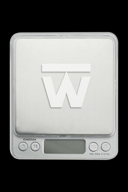Front view of the Truweigh Enigma Digital Mini Scale, displaying a black screen and silver buttons on a white surface.