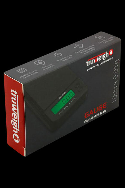 Front view of the Truweigh Gauge Digital Mini Scale, showing its sleek, compact design and branding on a dark background.