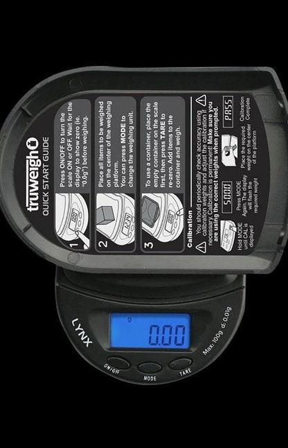 Close-up of the Truweigh Lynx Digital Mini Scale displaying "0.00" with instruction labels surrounding the digital face.