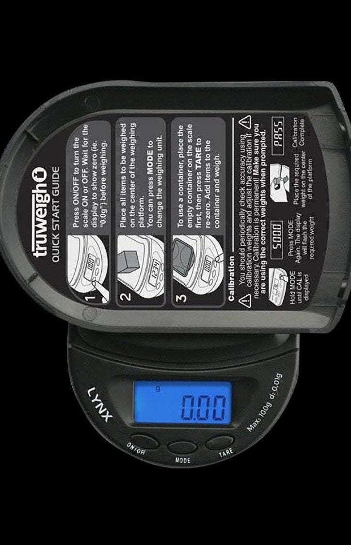 Close-up of the Truweigh Lynx Digital Mini Scale displaying "0.00" with instruction labels surrounding the digital face.