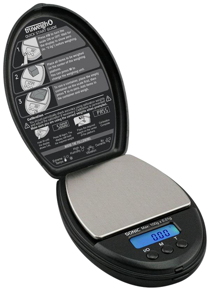 A close-up, angled view of the Truweigh Sonic Digital Mini Scale, displaying a digital readout on its black surface.