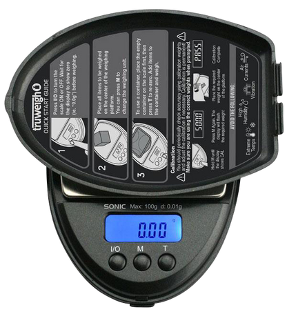 Close-up, top-down view of the Truweigh Sonic Digital Mini Scale, displaying a digital readout on its silver surface.