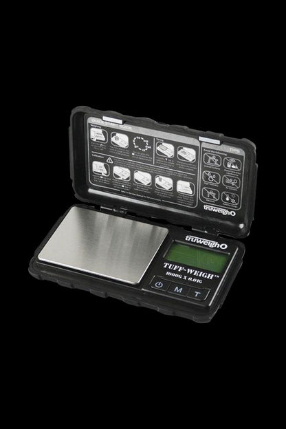 A close-up, top-down view of the Truweigh Tuff-Weigh Mini Scale with a black and silver design, showcasing its digital display.