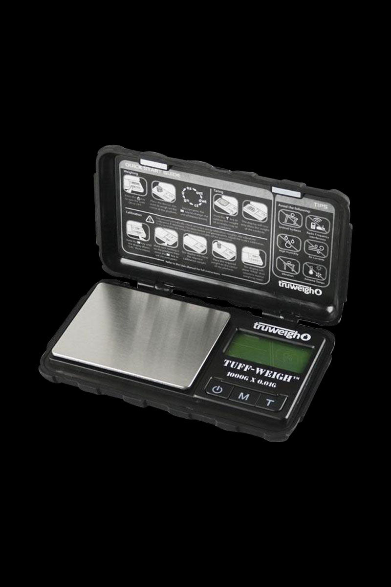 A close-up, top-down view of the Truweigh Tuff-Weigh Mini Scale with a black and silver design, showcasing its digital display.