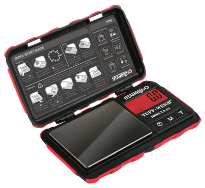 A top-down view of the open Truweigh Tuff-Weigh Mini Scale, displaying its internal components and instructional guide.