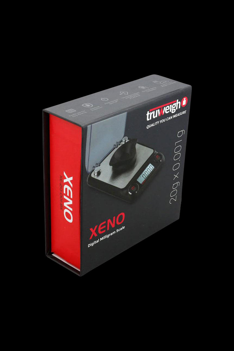A close-up, angled view of the Truweigh Xeno Digital Milligram Scale displaying its sleek, minimalist design and digital readout.