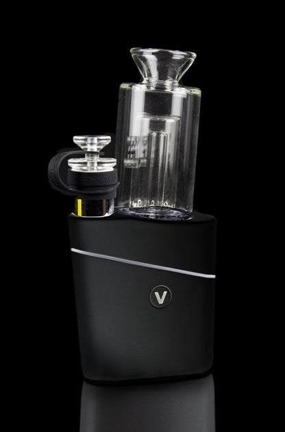 Black cannabis vaporizer with a glass bubbler attachment.